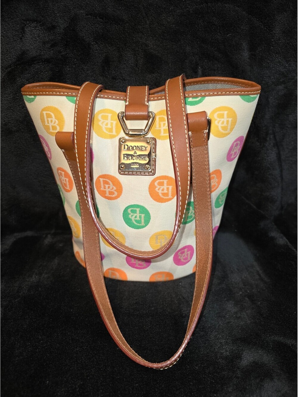 74. Dooney & Bourke Rainbow Bubble Dot Bucket Tote Bag
